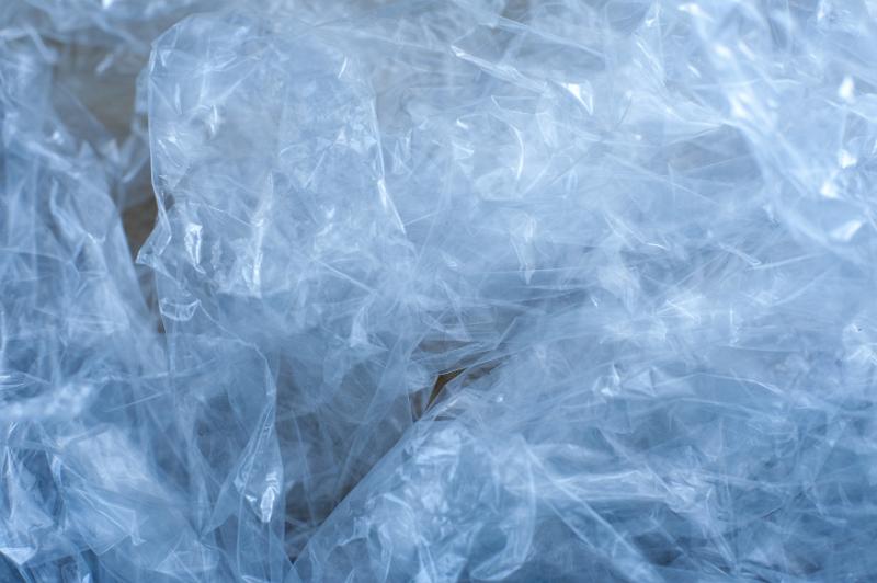 Free Stock Photo: Close up on wrinkled clear blue tinted plastic wrap as abstract background with copy space