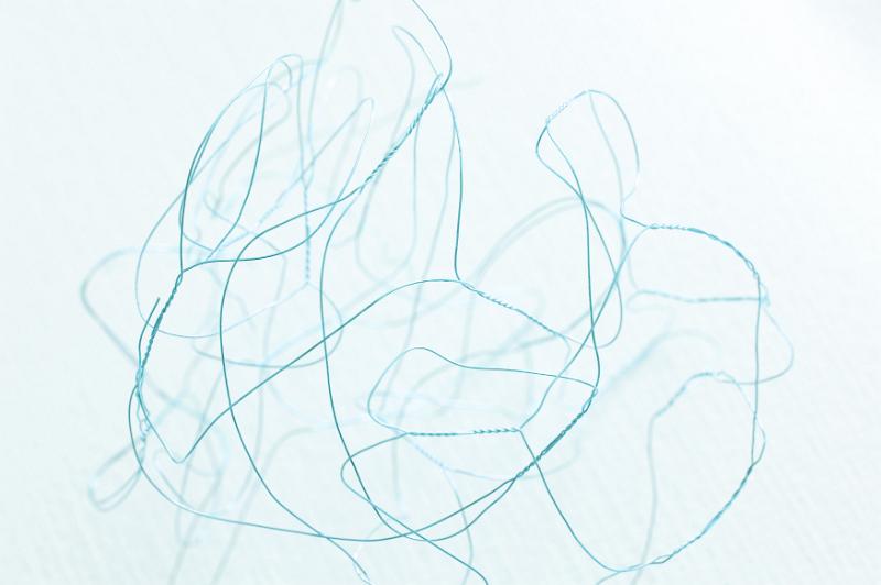 Free Stock Photo: Dainty abstract background made of one tangled blue wire appearing to float in liquid