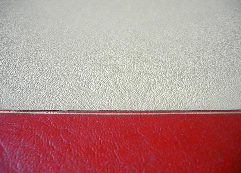 Free Stock Photo: Top down close up on red and white book cover with fine leather type texture and copy space