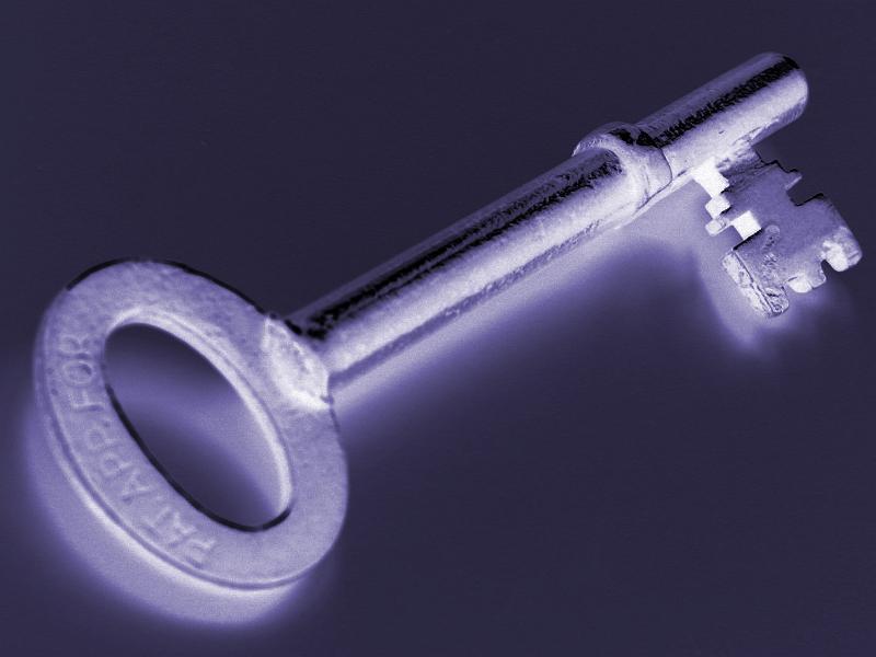 Free Stock Photo: Negative image of an antique door key with rounded end against a dark background