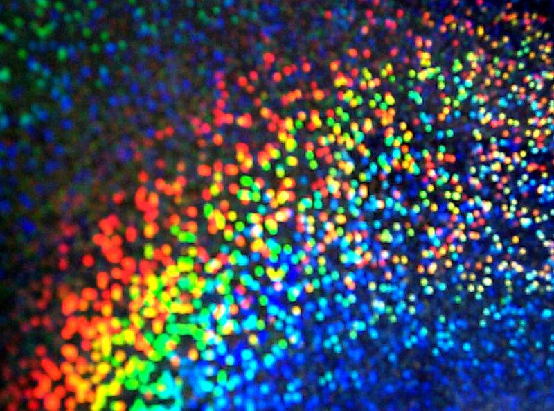 Free Stock Photo: Abstract background composed of colorful dots beginning with blue then green yellow and finally orange and red