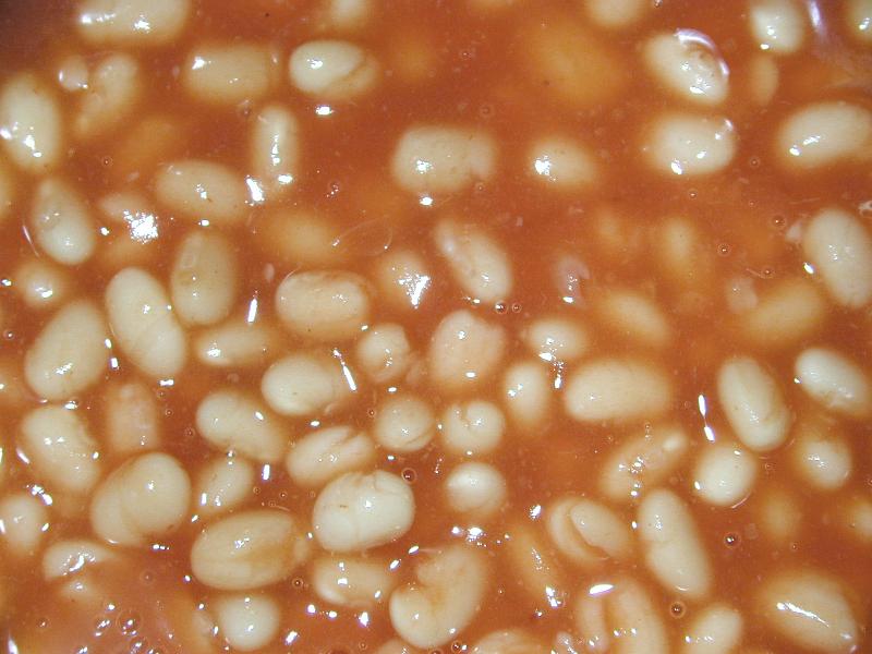 Free Stock Photo: Baked beans in tomato sauce background texture for a healthy quick snack or meal in a full frame closeup overhead view