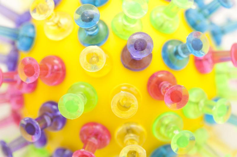 Free Stock Photo: Macro view on various colored translucent plastic push pins stuck in yellow tennis ball