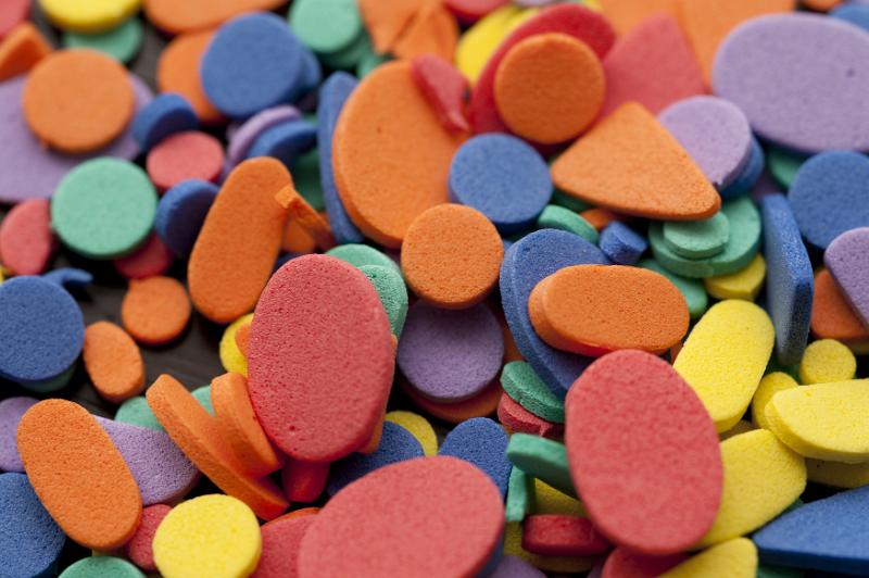 Free Stock Photo: Close up of assorted red blue orange and yellow foam triangle and oval shapes