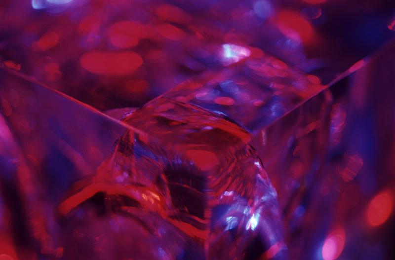 Free Stock Photo: Selective focus view on glass cube with fractured corner surrounded by purple and blue
