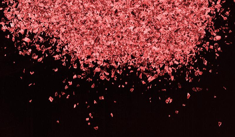 Free Stock Photo: Pile of little pink glitter or paper scraps at top of frame over black background with copy space