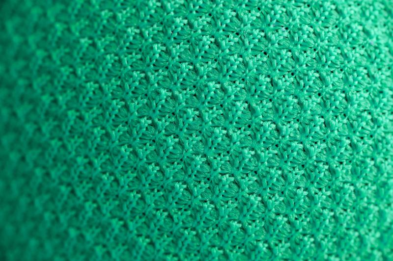 Free Stock Photo: Close up of green knitted sweater with delicate circular pattern