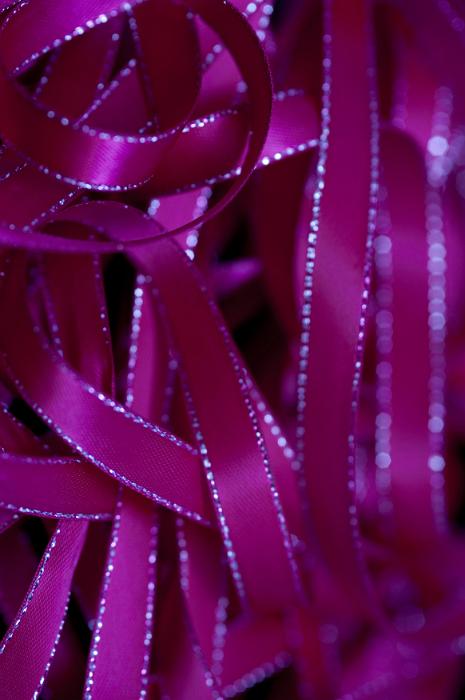 Free Stock Photo: Tangle of colorful pink ribbons edged with silver for a festive full frame background texture