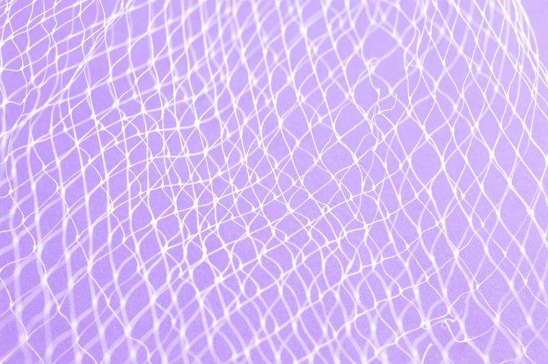 Free Stock Photo: Close up of white plastic netting against light purple background