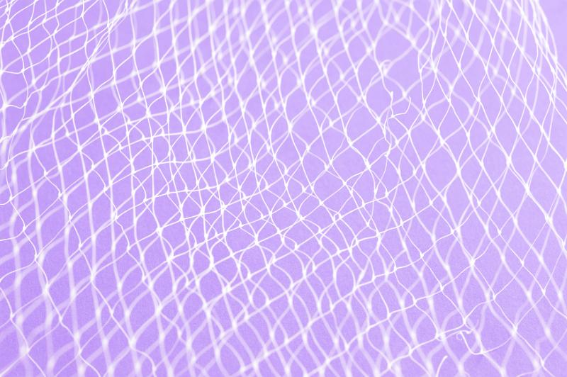 Free Stock Photo: Close up of white plastic netting against light purple background