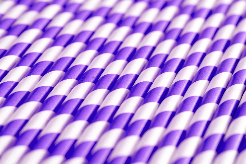 Free Stock Photo: Selective focus view on row of spiral pattern purple and white straws close together for full frame background