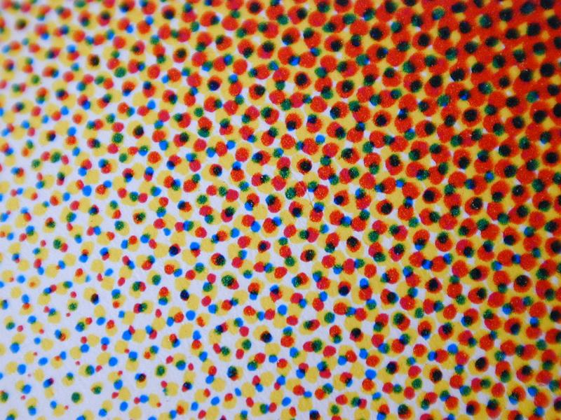 Free Stock Photo: Abstract background composed of red green blue and black dots on yellow
