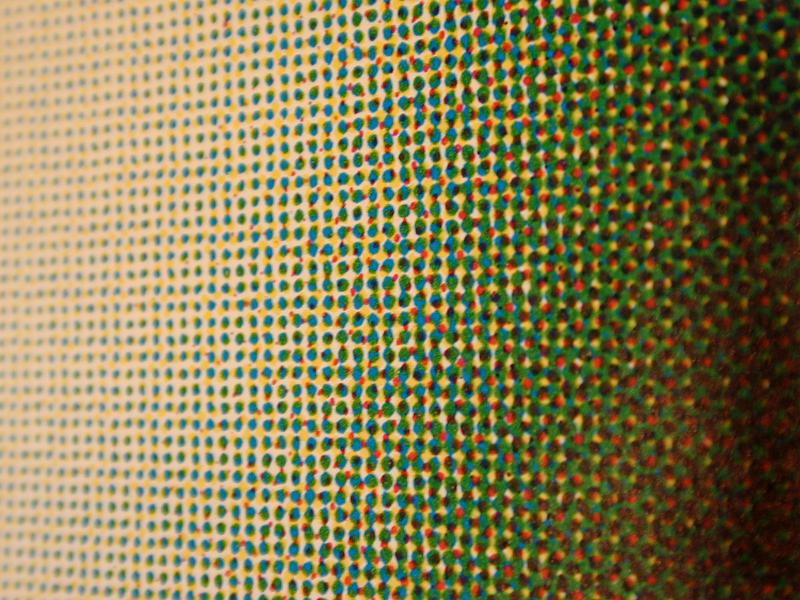 Free Stock Photo: Close up on abstract pattern of green, black and red halftone dots over yellow background