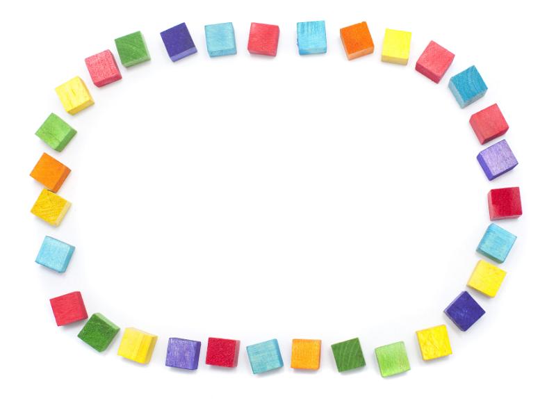 Free Stock Photo: Colorful oval frame of wooden toy building blocks in the colors of the rainbow arranged on white with copy space