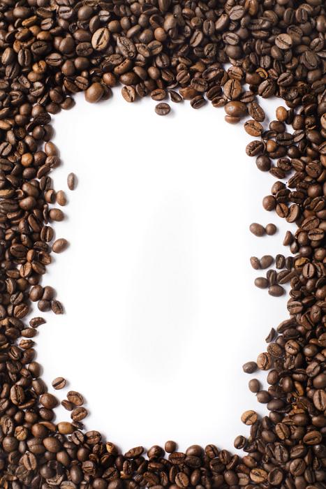 Free Stock Photo: Border of aromatic medium roast coffee beans arranged around central white copy space for your text or advertising