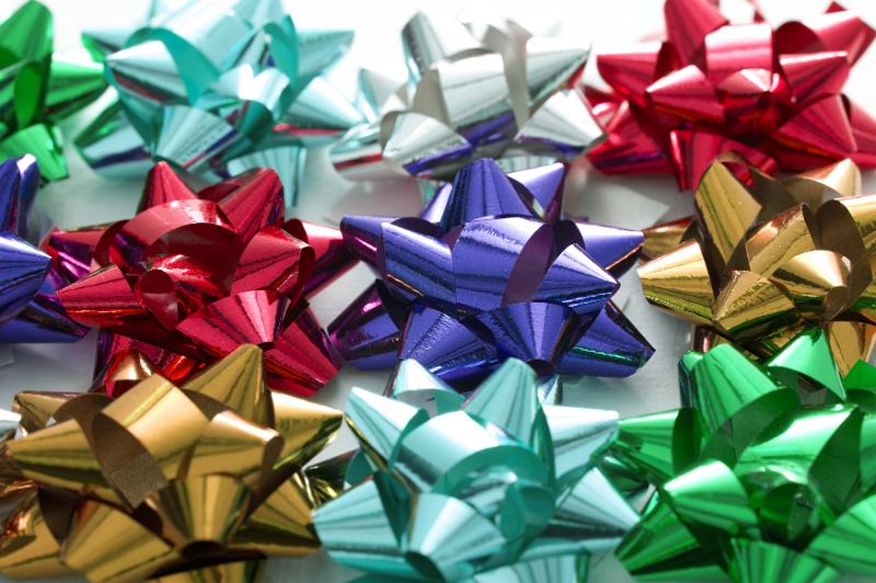 Free Stock Photo: Collection of colorful decorative bows in shiny ribbon for decorating and wrapping gifts for festive occasions