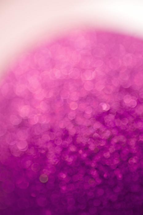 Free Stock Photo: Diffuse curved pink glitter ball in a soft defocused background with copy space above
