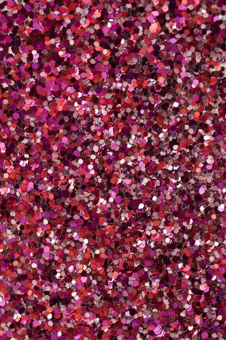 Free Stock Photo: Colorful red glitter background texture with a mix of red, silver and pink craft glitter in a full frame view for party or holiday concepts