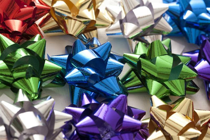 Free Stock Photo: Colorful background of decorative bows in shiny ribbon for decorating gifts and packaging in assorted colors viewed from above