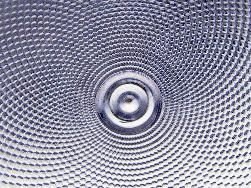 Free Stock Photo: Extreme close up of textured metal surface that forms abstract design and with a smooth shiny circular center