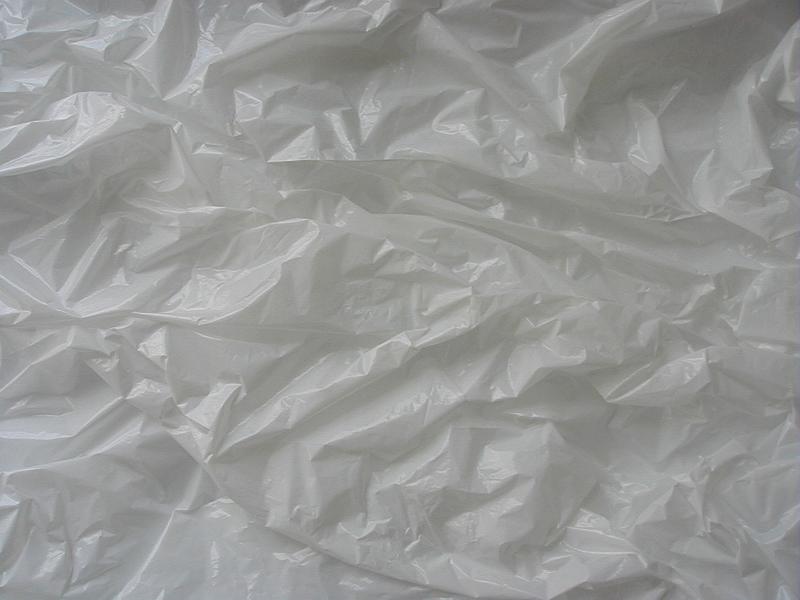 Free Stock Photo: Crumpled dingy grey plastic sheeting background texture viewed from above in a full frame view