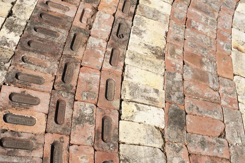 Free Stock Photo: Curving brick paving with decorative pattern of different shapes and colors of brick viewed from above in a full frame background