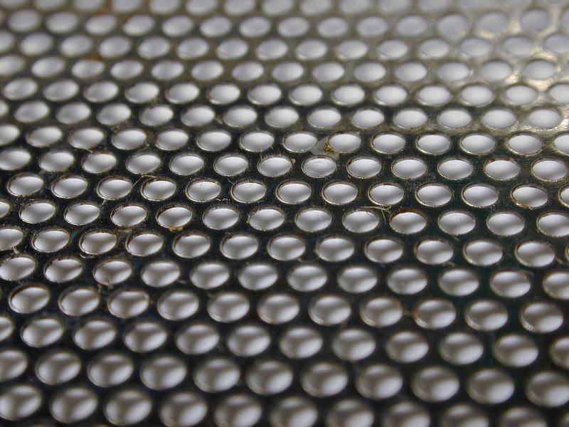 Free Stock Photo: Close up on circular mesh over gray background for concepts about technology or rigid structures