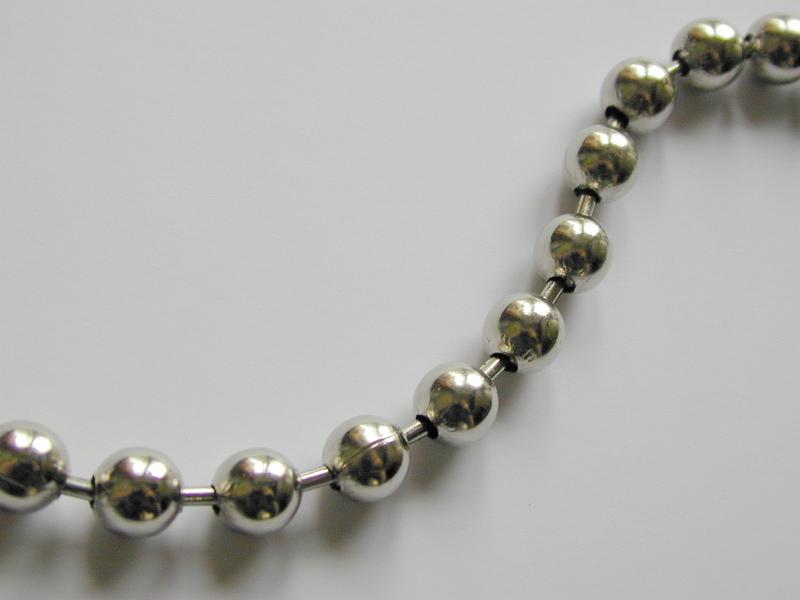 Free Stock Photo: Top down view on close up of chrome finished balls attached to one another in metal necklace