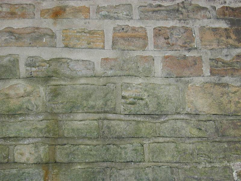 Free Stock Photo: Stone and mortar wall with pale green moss or algae stains near bottom half with copy space