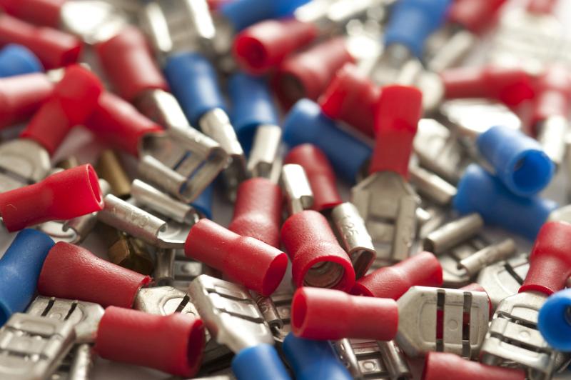 Free Stock Photo: Close up background of blue and red car connectors piled into one large bunch as sun pour down onto them