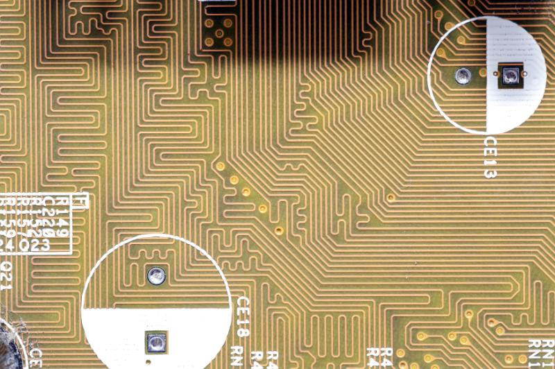 Free Stock Photo: Top down detail view of matching inductance circuits with half circles near letters and numbers as background about electronics and technology