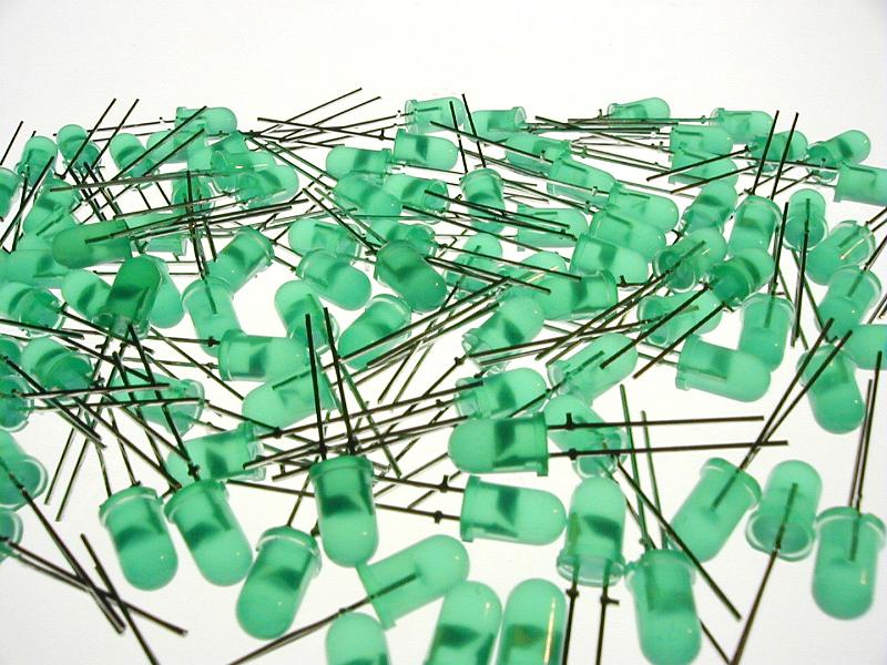 Free Stock Photo: Scattered pile of new green colored light emitting diodes over isolated white background