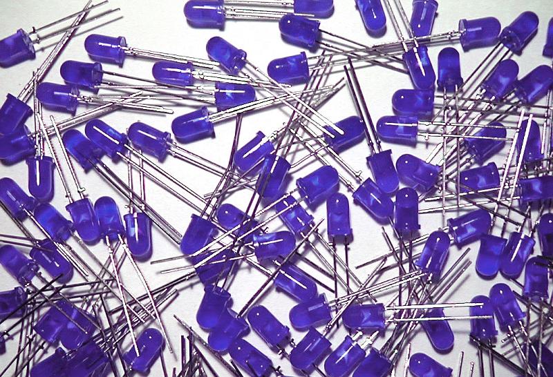 Free Stock Photo: Pile of assorted purple light emitting diodes over white for technology or electronics concepts
