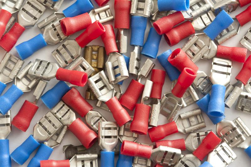 Free Stock Photo: Top down view on pile of scattered low power automobile electrical connectors in red and blue colors