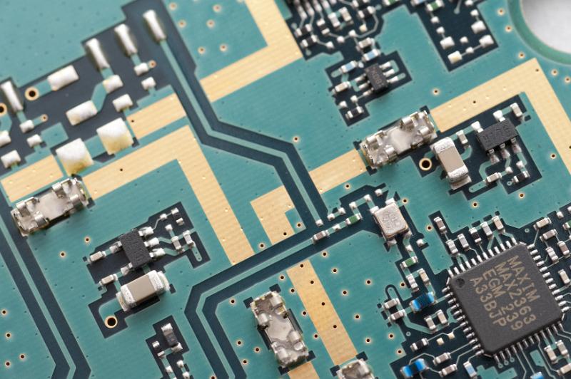Free Stock Photo: Top down view on computer circuit board with green and copper colored wiring and soldered transistors