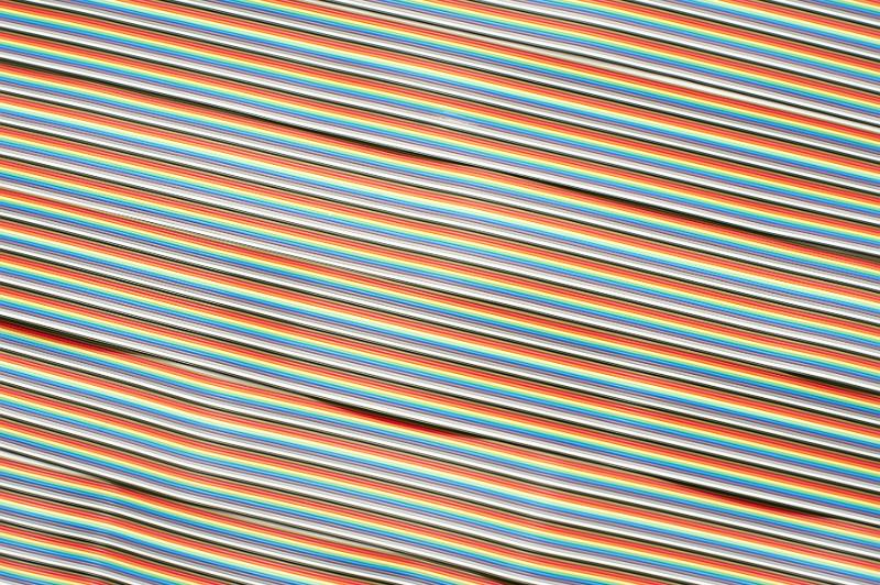 Free Stock Photo: Horizontal angled strands of computer wire ribbon colored in red, yellow, blue, green, purple, white and black