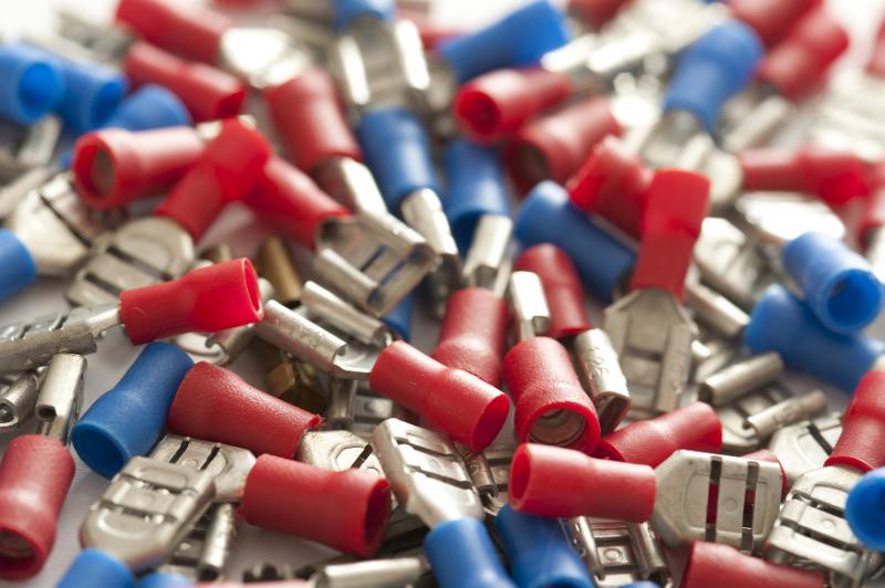 Free Stock Photo: Close up of red and blue colored computer parts with plastic cylinders at one end and metal on the other