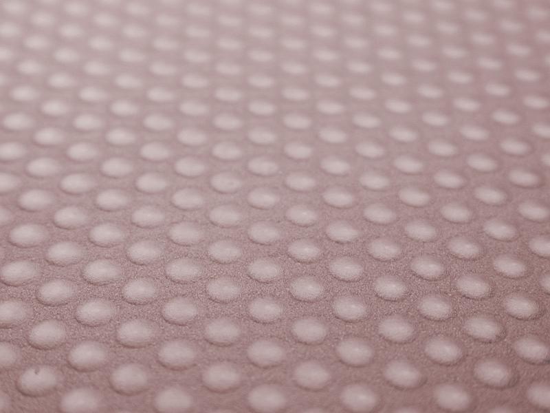 Free Stock Photo: Red bumpy sidewalk background with circular raised parts in focus in the middle section