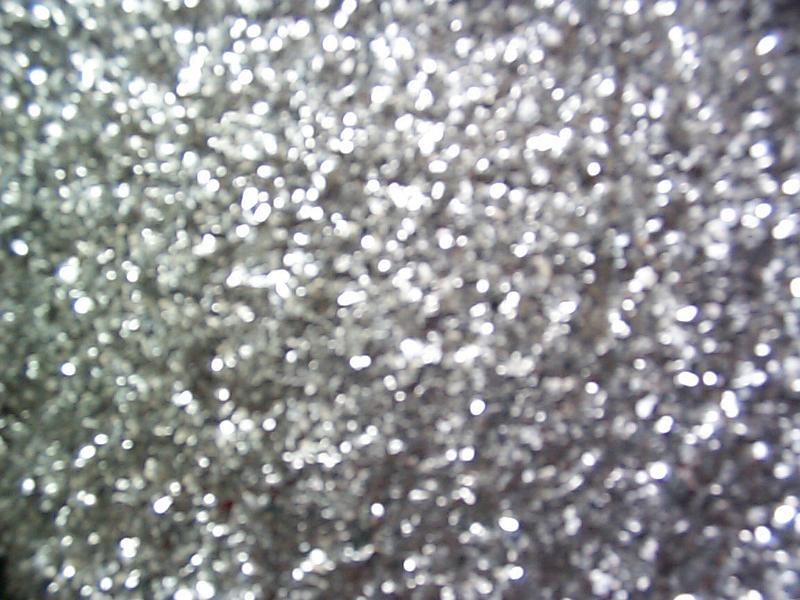 Free Stock Photo: Full frame festive background of sparkling silver glitter to celebrate a holiday or special occasion or for use in craft work