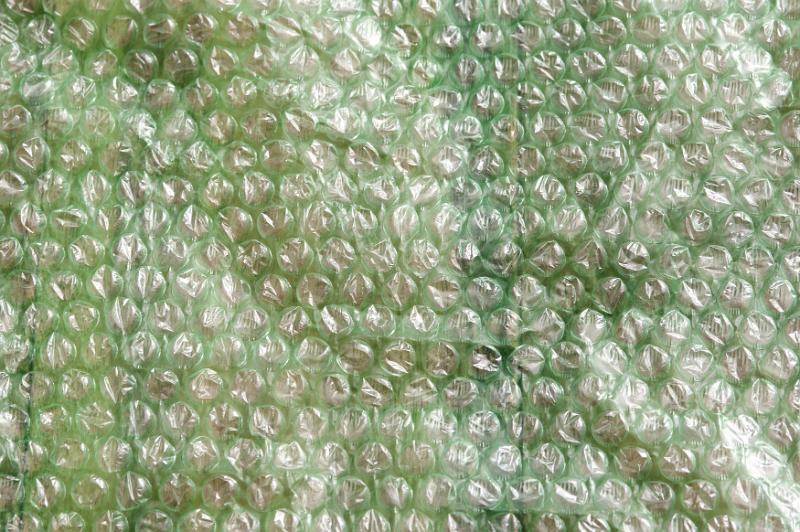 Free Stock Photo: Simple green small plastic bubble wrap packaging textured background with copy space
