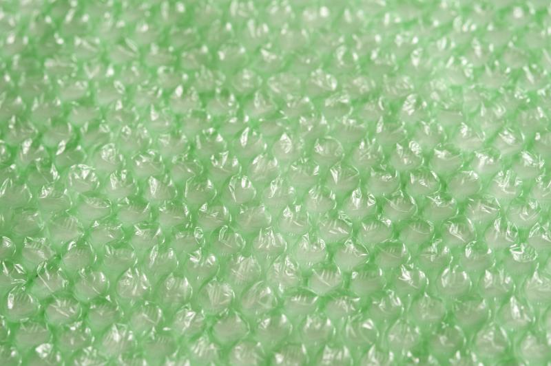 Free Stock Photo: Background texture of light green bubble wrap for use in packaging for providing protection, full frame view