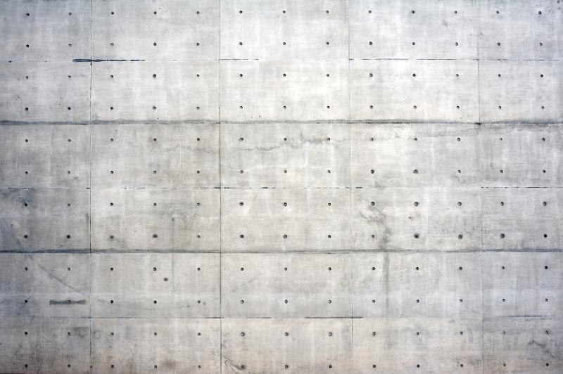 Free Stock Photo: Large background wall of reinforced concrete with copy space holes for rods showing