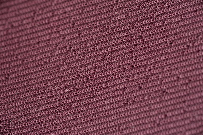 Free Stock Photo: Close up on maroon colored little loopy fabric string in rows as abstract background with copy space