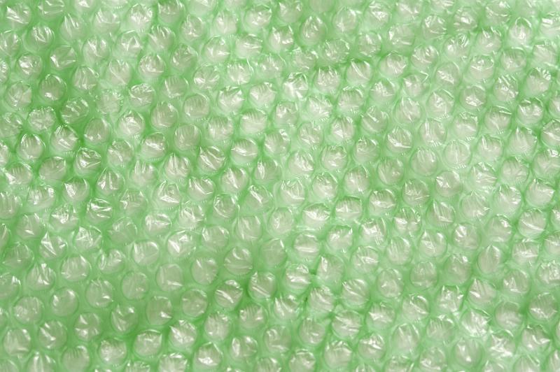 Free Stock Photo: Extreme close up background pattern of green plastic bubble wrap unraveled for full frame with copy space