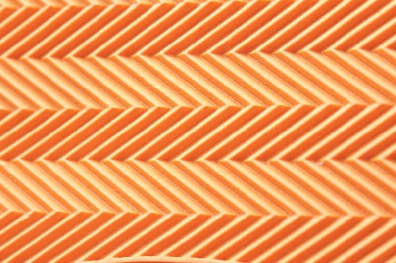 Free Stock Photo: Herringbone style ribs orange background pattern with subtle lines as on an athletic shoe
