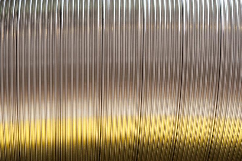 Free Stock Photo: Abstract background composed of ridged metal can with yellow highlights underneath