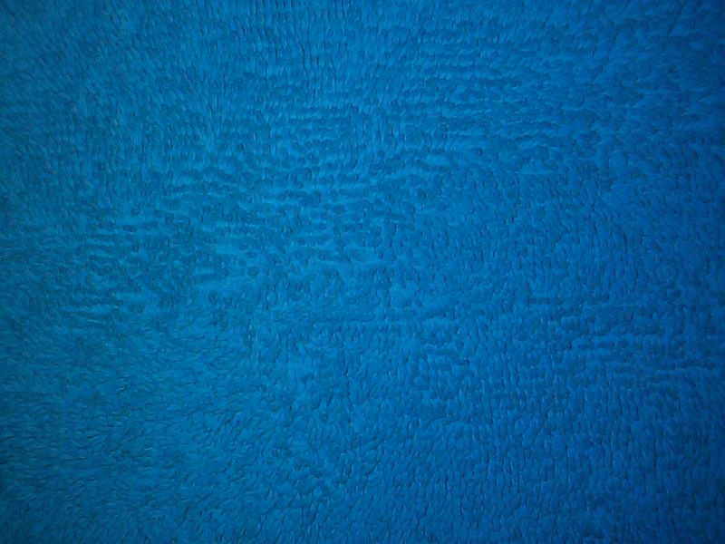 Free Stock Photo: Rough blue texture with darker vignette edges in full frame with copy space