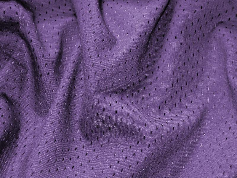 Free Stock Photo: Soft luxurious folded purple fabric with a sateen pattern of darker dots in a full frame decor background