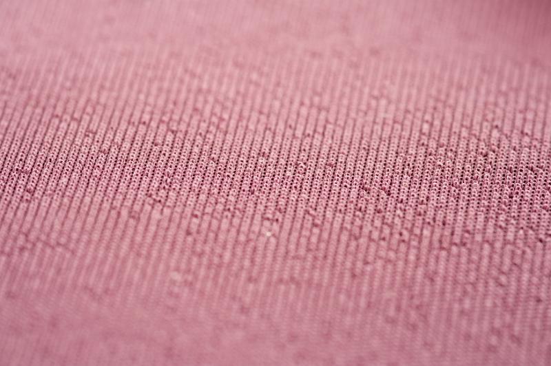 Free Stock Photo: Full frame close up on center of red woven fabric in focus with copy space