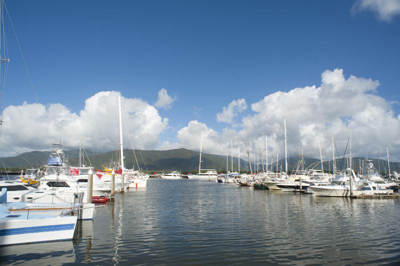 Free Stock Photo: Scenic view of Cairns marina with pleasure boats, sailboats and yachts moored in the sheltered water on a sunny summer day